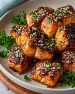 Air fryer salmon bites cooked to perfection, golden and crispy.