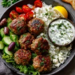 Plate of Greek Turkey Meatballs drizzled with Tzatziki sauce