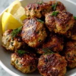 Juicy roasted Greek meatballs served with herbs and spices
