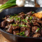 Delicious plate of Mongolian Beef with tender beef slices and savory sauce