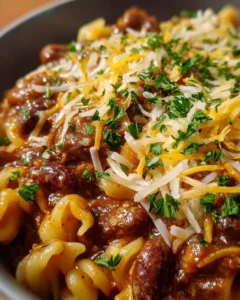 One-pot chili mac and cheese ready to serve in a bowl.