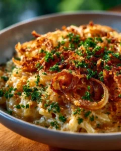 French onion chicken orzo casserole topped with melted cheese