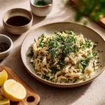 Slow Cooker Lemon Garlic Chicken dish with herbs and lemon slices