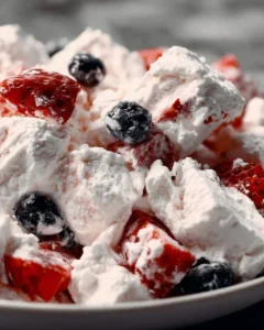 Very Berry Cheesecake Salad with fresh berries and creamy cheesecake topping