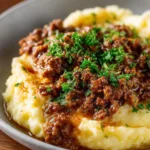 Delicious homemade beef gravy served over mashed potatoes