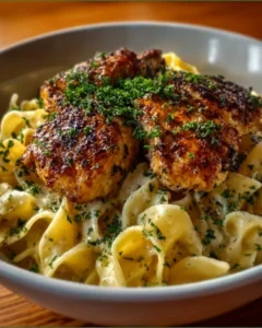 Plate of Chicken with Buttered Noodles, garnished with parsley.