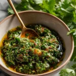 Delicious chimichurri sauce served over grilled steak