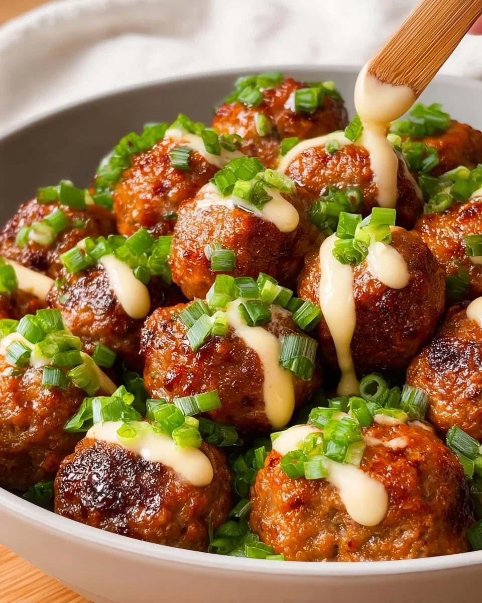 Crock Pot Buffalo Ranch Meatballs served in a white bowl with celery sticks