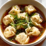 Bowl of easy homemade wonton soup with fresh ingredients