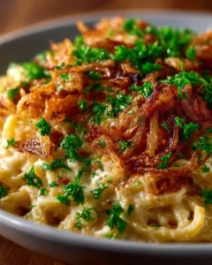 French onion chicken orzo casserole topped with cheese