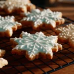 Deliciously decorated rolled sugar cookies on a baking sheet.