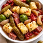 Delicious marinated cheese appetizer served on a platter