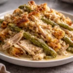 Slow Cooker Chicken and Stuffing topped with herbs in a cozy kitchen setting.