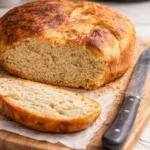 Crockpot sourdough bread loaf with golden crust and rustic appearance