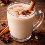 A delicious Vanilla Chai Tea Latte topped with frothy milk and spices.