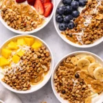 Healthy yogurt granola bowl topped with fresh fruits and nuts