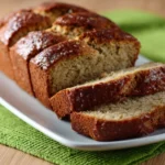 Freshly baked zucchini bread cooling on a rack