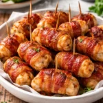 Bacon-wrapped chicken bites on a serving platter