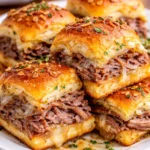 Platter of Easy French Dip Sliders with au jus for dipping