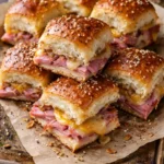 Easy ham and cheese Hawaiian sliders recipe with rolls and melted cheese.