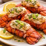Delicious garlic butter lobster tails served on a plate.