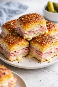 Delicious Ham and Swiss Sliders served on a platter