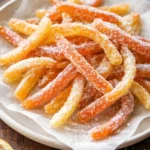 Homemade candied orange peel in a bowl, ready to enjoy or use in recipes.