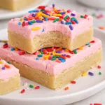 Deliciously baked sugar cookie bars with colorful sprinkles on top