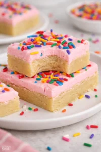 Deliciously baked sugar cookie bars with colorful sprinkles on top