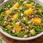 Fresh arugula citrus salad with vibrant oranges and a light dressing.
