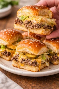 Big Mac sliders on a platter, featuring juicy beef and signature sauce.