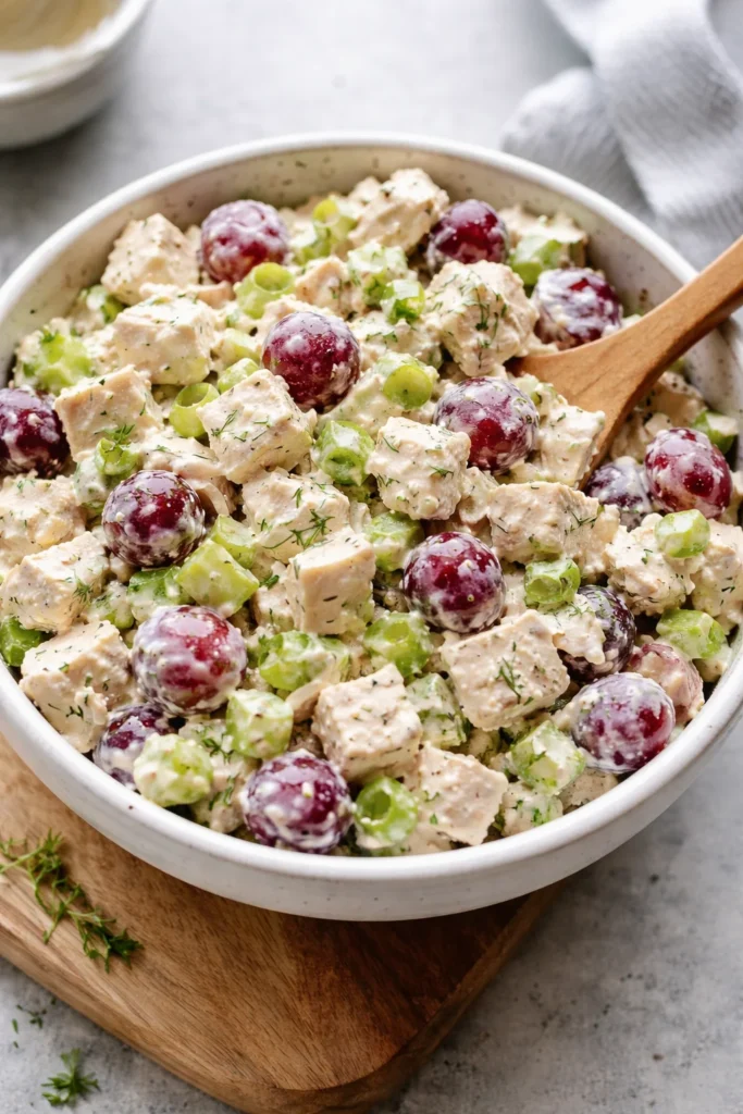 Delicious creamy chicken salad served in a bowl with fresh vegetables