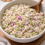 Creamy rotisserie chicken salad in a bowl with fresh vegetables