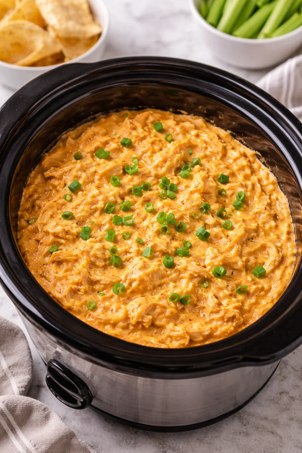 Delicious Crockpot Buffalo Chicken Dip served in a bowl with tortilla chips
