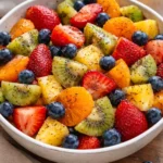 Fresh fruit salad topped with honey lime poppy seed dressing