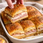Delicious ham and cheese sliders served on a platter for parties and gatherings.