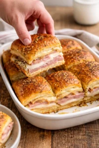 Delicious ham and cheese sliders served on a platter for parties and gatherings.