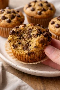 Healthy peanut butter banana muffins freshly baked and served on a plate.