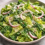 A vibrant bowl of homemade Parmesan Chopped Salad with fresh vegetables and cheese