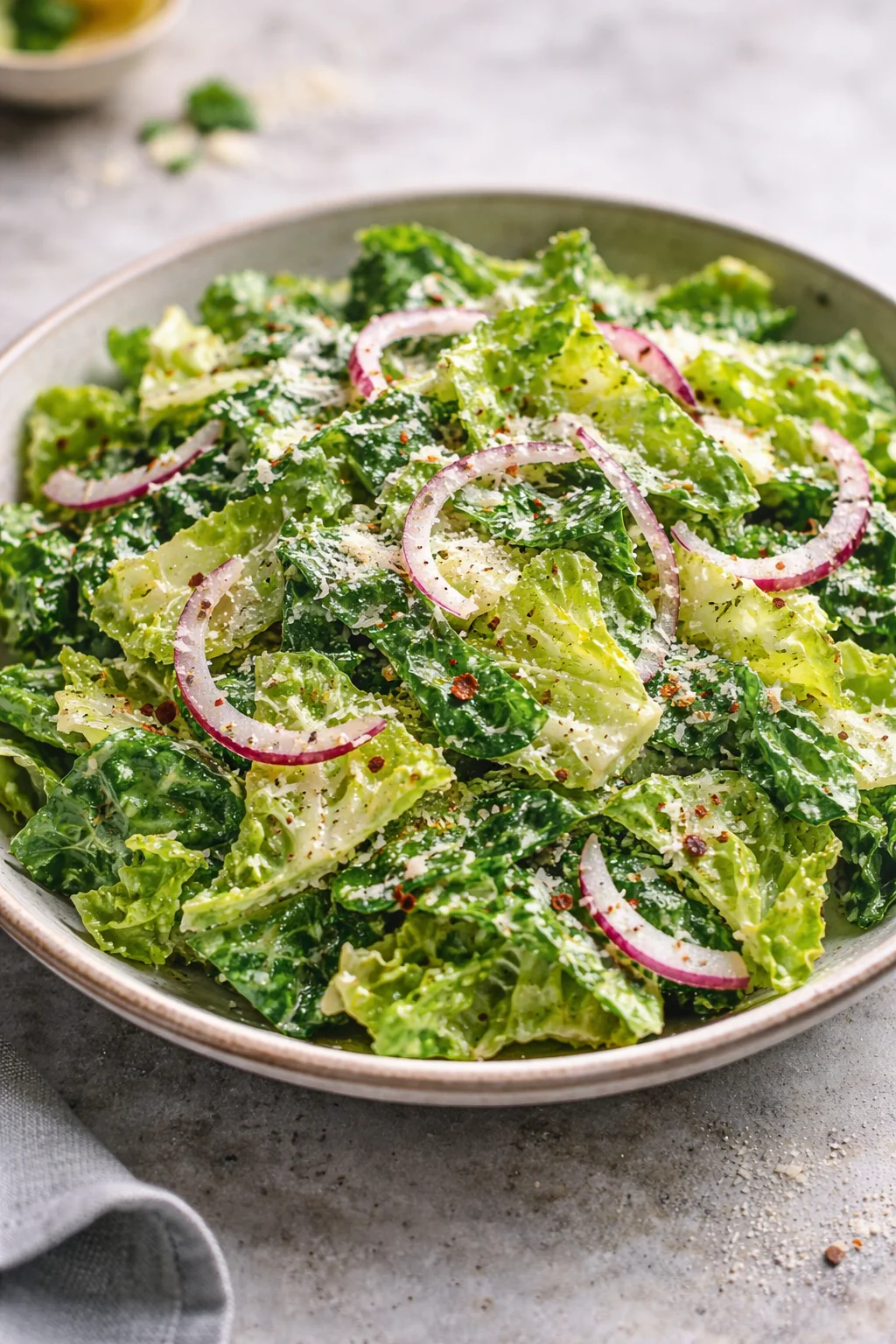 A vibrant bowl of homemade Parmesan Chopped Salad with fresh vegetables and cheese