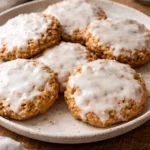 Delicious iced oatmeal cookies with a smooth icing on top, perfect treat.