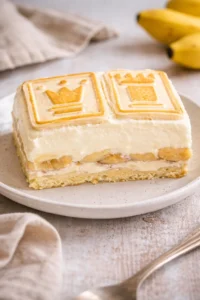 No-bake banana pudding dessert in a glass with whipped cream and banana slices