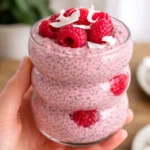 Delicious bowl of Raspberry Chia Pudding topped with fresh raspberries