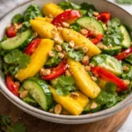 Colorful Thai Mango Salad with fresh mango, herbs, and vegetables