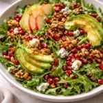 Winter Christmas Salad topped with honey mustard dressing and vibrant seasonal ingredients