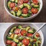Cucumber tomato avocado salad in a bowl with fresh ingredients