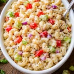 Gordon Ramsay-inspired macaroni salad with fresh ingredients and vibrant colors.