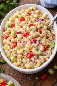 Gordon Ramsay-inspired macaroni salad with fresh ingredients and vibrant colors.