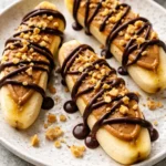 Delicious low calorie frozen banana snickers dessert with nuts and chocolate