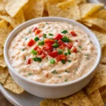 Deliciously creamy Rotel Ranch Dip served with chips for a perfect snack.